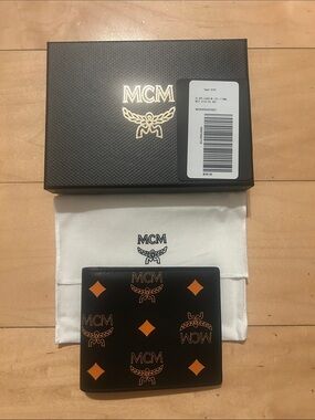 MCM Black Leather Bifold Wallet with Orange Monogram Motif